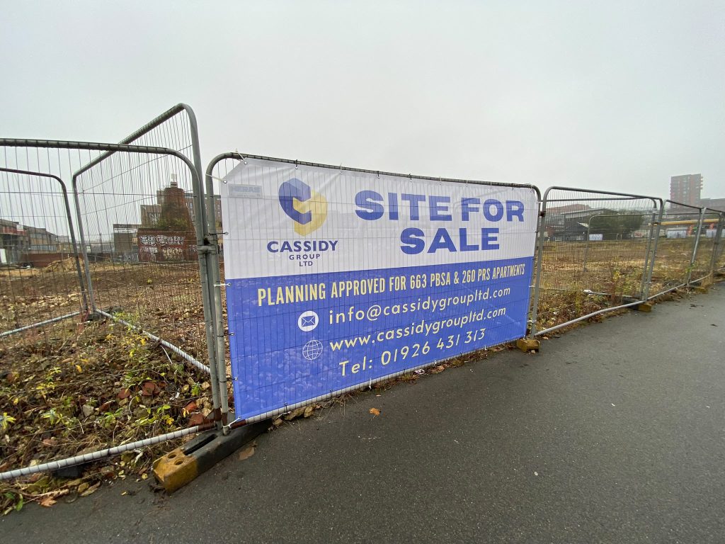 Printed Heras fence banner on a building site